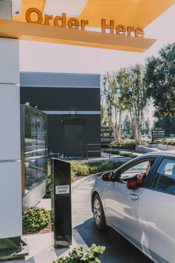 car ordering food from a drive thru