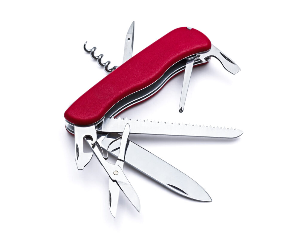 swiss army knife red that is open on white